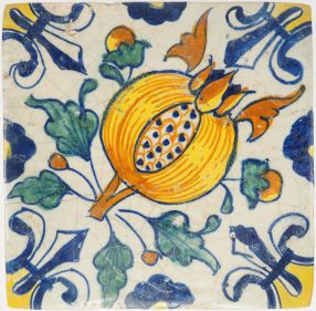Antique Delft tile with pomegranate and fleur-de-lis corner motifs, 17th century