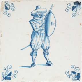Antique Delft tile with blue soldier and shield, 17th century