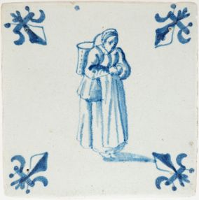 Antique Delft tile of a woman on her way to market with basket, 17th century