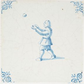 Antique Delft tile in blue with a boy playing with a ball, 17th century