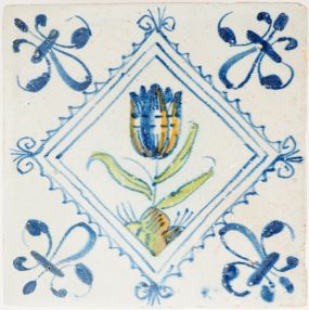 Antique Delft tile with polychrome tulip in diamond square, 17th century