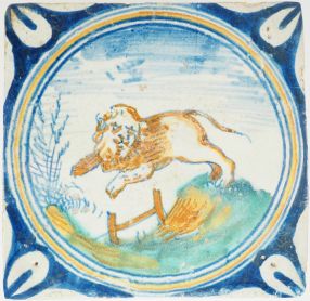 Antique Delft tile showing a lion leaping over a fence, 17th century