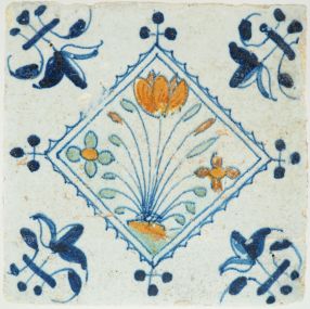 Antique Delft tile with a tulip & flowers, 17th century