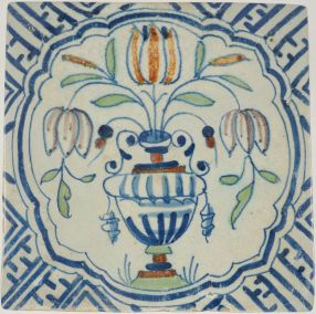 Antique Delft tile with flower vase in scalloped border, 17th century