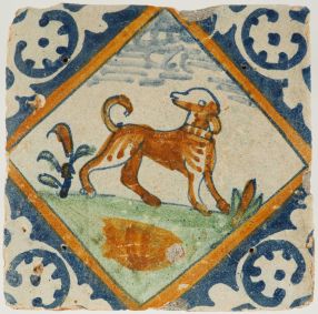 Antique Delft tile with playful dog in diamond square, 17th century
