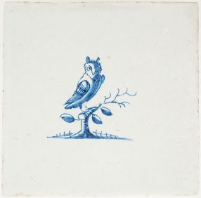Antique Delft tile with a wild owl on a branch, 17th century