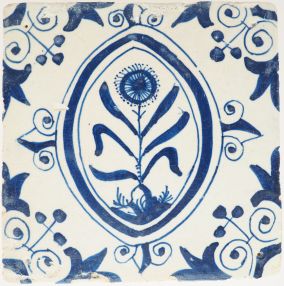 Antique Delft tile with flower in oval border, 17th century