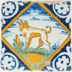 Antique Delft tile with a polychrome dog in a diamond square, 17th century