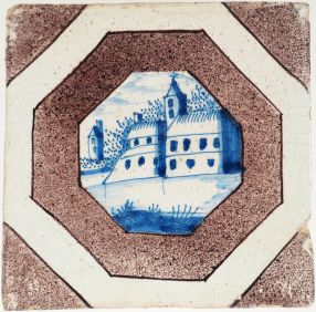 Antique Delft wall tile with a stronghold in blue within a manganese accolade border, 18th century