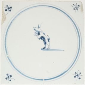 Antique Delft wall tile with a blue leaping dog, 18th century