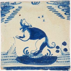 Antique Rotterdam Open Air Delft wall tile depicting a leaping dog, 17th century