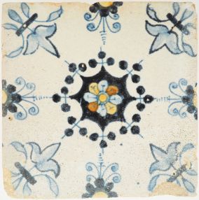 Rare polychrome antique Delft tile with central rosette and Fleur-de-Lis corner motifs, 17th century