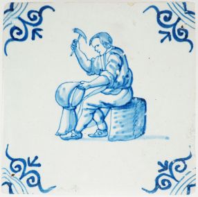 Antique Delft tile depicting a coppersmith at work, 17th century