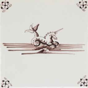 Hand-painted Delft tiles with sea creatures in blue, decorated with the spider curl corner motif and enhanced with pinholes and a crackled finish