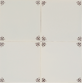 Decorative hand-painted Delft tile with spider curl corner motif design in manganese