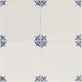 Ox-head corner motif Delft tile (PCM-20) in traditional blue, hand-painted with refined detailing. Shown with pinholes but no crackled finish.