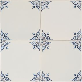Large ox-head corner motif Delft tile (PCM-21) in traditional blue, hand-painted on the grey mix with pinholes but no crackled finish.