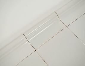 Plain white Delft trim tile - Trim B - on the grey mix