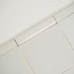 Plain white Delft trim tiles by Poarte - Trim E - on the Grey mix