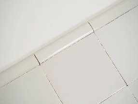 Plain white Delft trim tiles by Poarte - Trim E - on the Grey mix