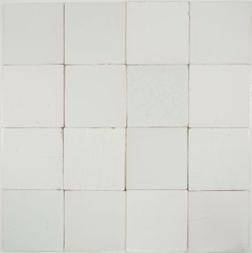 Plain white antique Dutch Delft tiles dating from around 1900