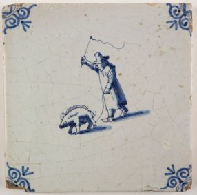 Antique Delft tile with a swineherd, 17th century