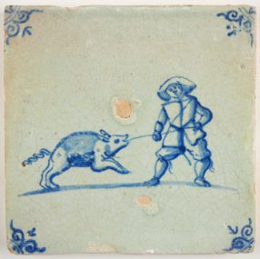 Antique Delft tile with a man fighting a swine, 17th century