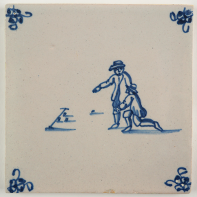 Antique Delft tile with two children playing a game of marbles, 18th century