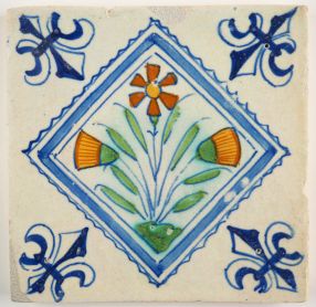 Antique Delft polychrome tile with flowers in a diamond square, 17th century
