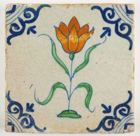 Early 17th century Delft tile with a large orange tulip. 