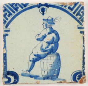 Antique Delft tile in blue with a man resting on a wine barrel, 17th century