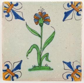 Antique Delft tile with a dianthus flower, 17th century