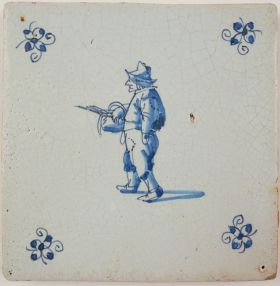 Antique Delft tile with a man wearing repaired cloths, 17th century