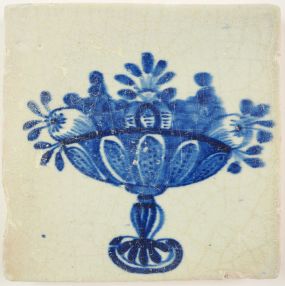 Antique Delft tile with a fruit bowl, 17th century