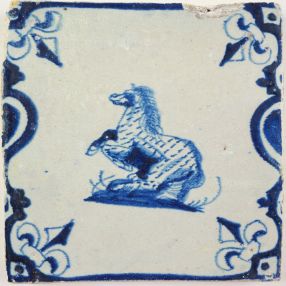 Antique Delft tile with a prancing horse, 17th century