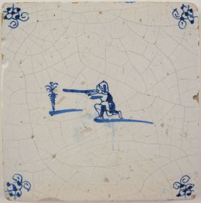 Antique Delft tile with a target shooting scene, 17th century