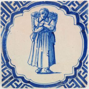  Antique Delft tile with a woman carrying goods, 17th century