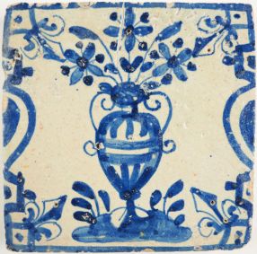 Antique Delft tile with a flowerpot in blue, 17th century