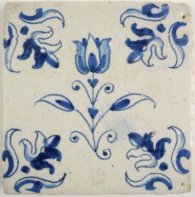Antique Delft tile with a tulip, 17th century
