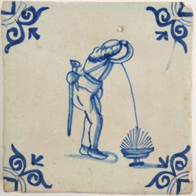 Antique Delft tile with a man puking, 17th century