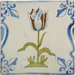 Antique Delft tile with a polychrome tulip, 17th century
