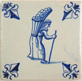 Antique Delft tile with a peddler, 17th century