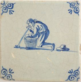 Antique Delft tile with a game of marbles, 17th century