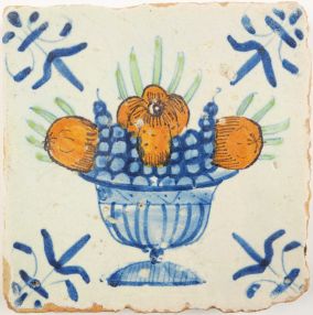 Antique Delft tile with a fruit bowl, 17th century