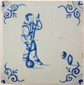 Antique Delft tile with a child playing a game of kolf, 17th century
