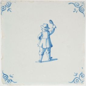 Antique Delft tile with a man playing badminton, 17th century