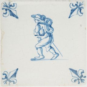 Antique Delft tile with a man selling blankets, 17th century