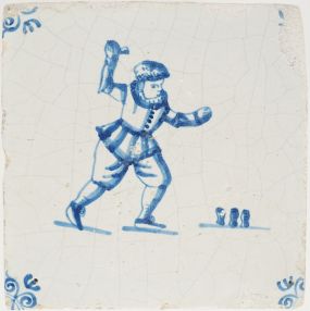 Antique Delft tile with a game of knucklebones, 17th century