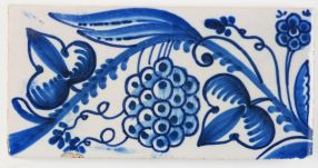Antique Delft border tile with grapes in blue, 19th century
