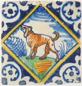 Antique Delft polychrome diamond square tile with a barking dog, early 17th century